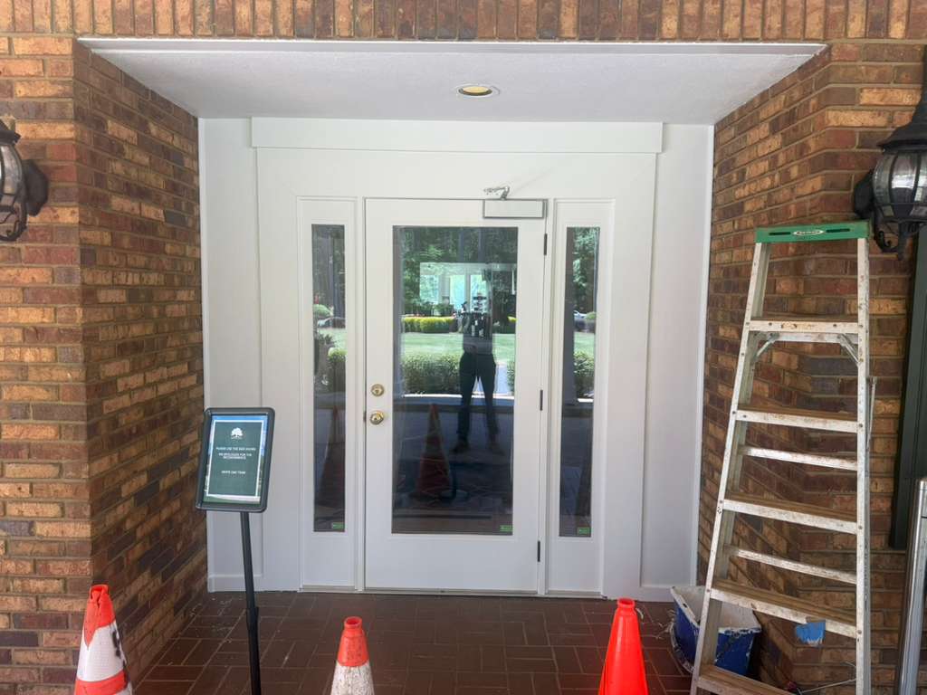 Finished door package — closer, hardware, and trim installed and back in service the same day.