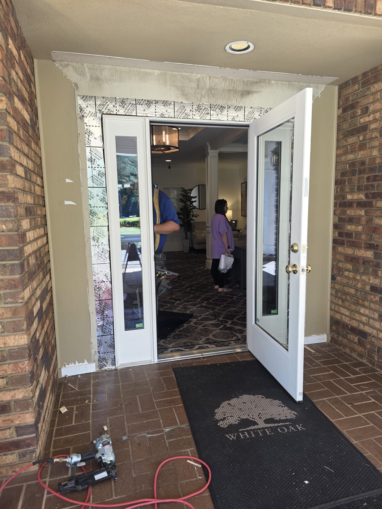 New entry door and sidelite frame set and flashed during a country club entrance replacement.