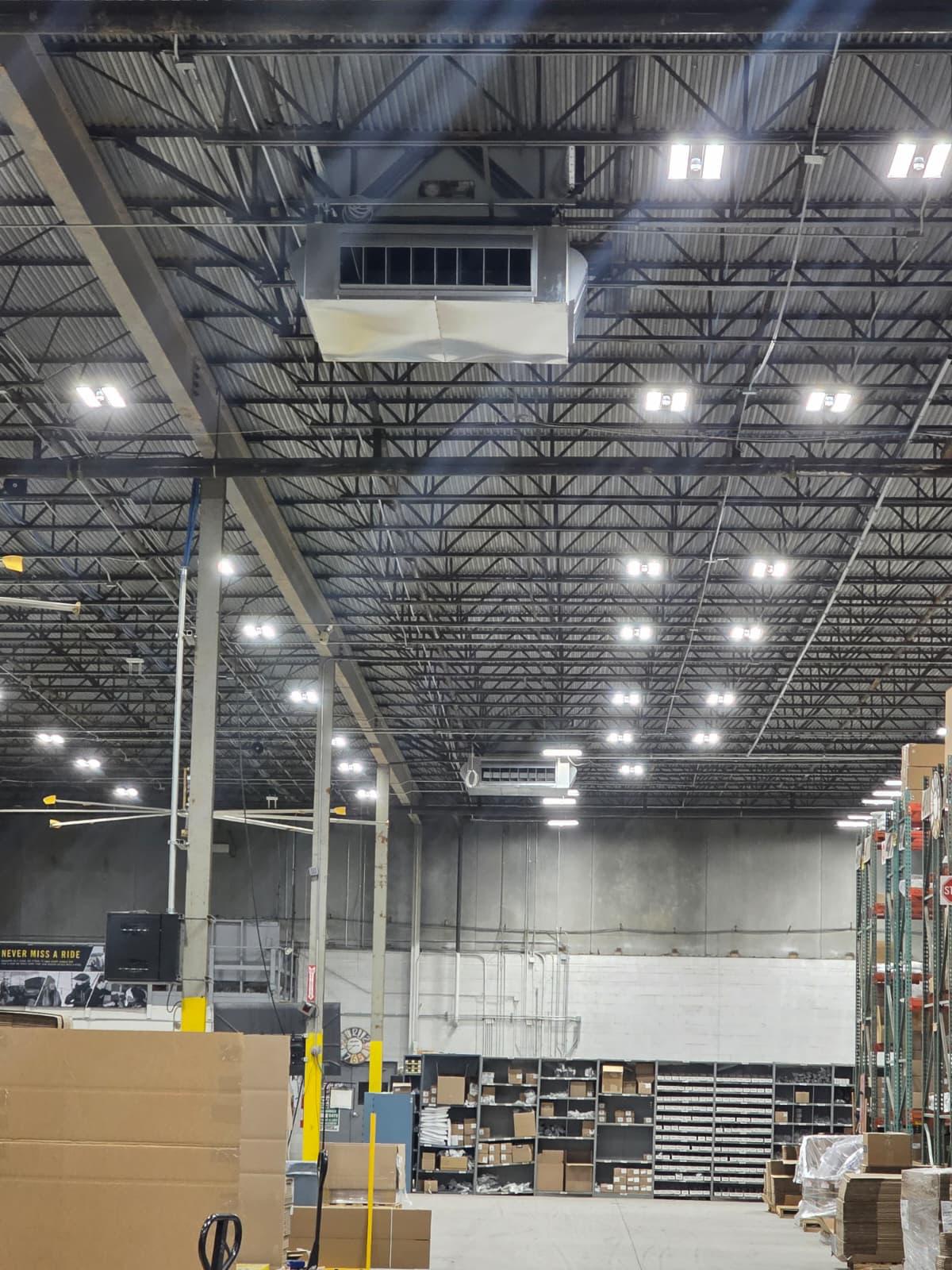 Warehouse air distribution and high-bay lighting in a recently serviced facility.