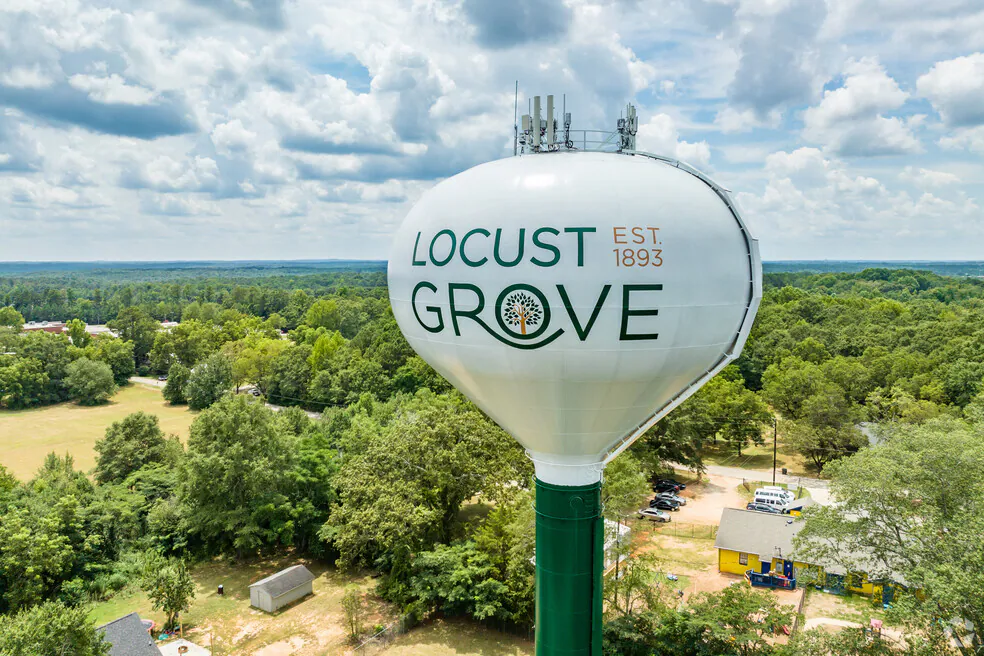 Locust Grove, Georgia water tower (Est. 1893) above the tree line
